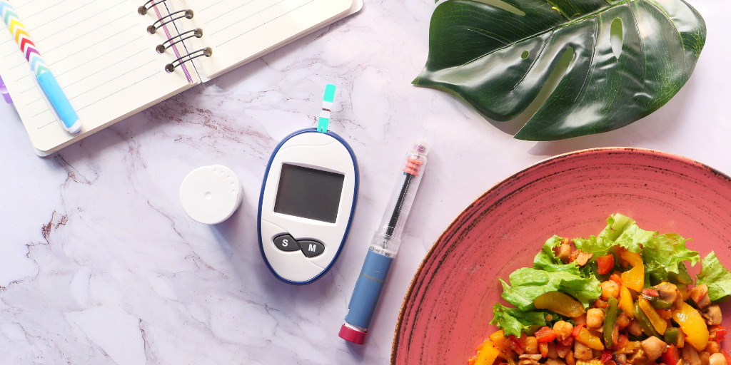 Photo of blood glucose monitor and food
